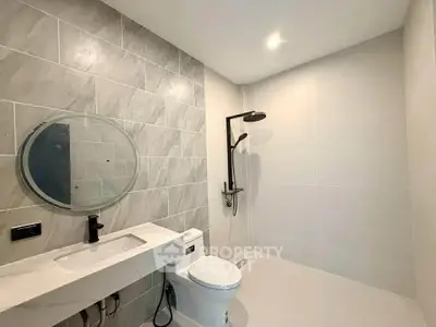 Modern bathroom with sleek design and elegant fixtures in a contemporary home.
