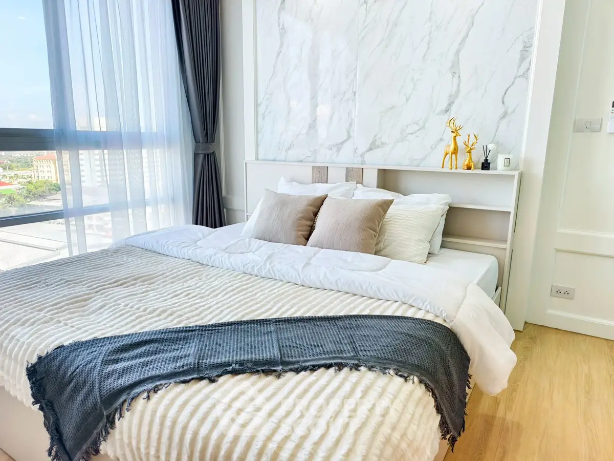 Luxurious bedroom with elegant decor and stunning city view