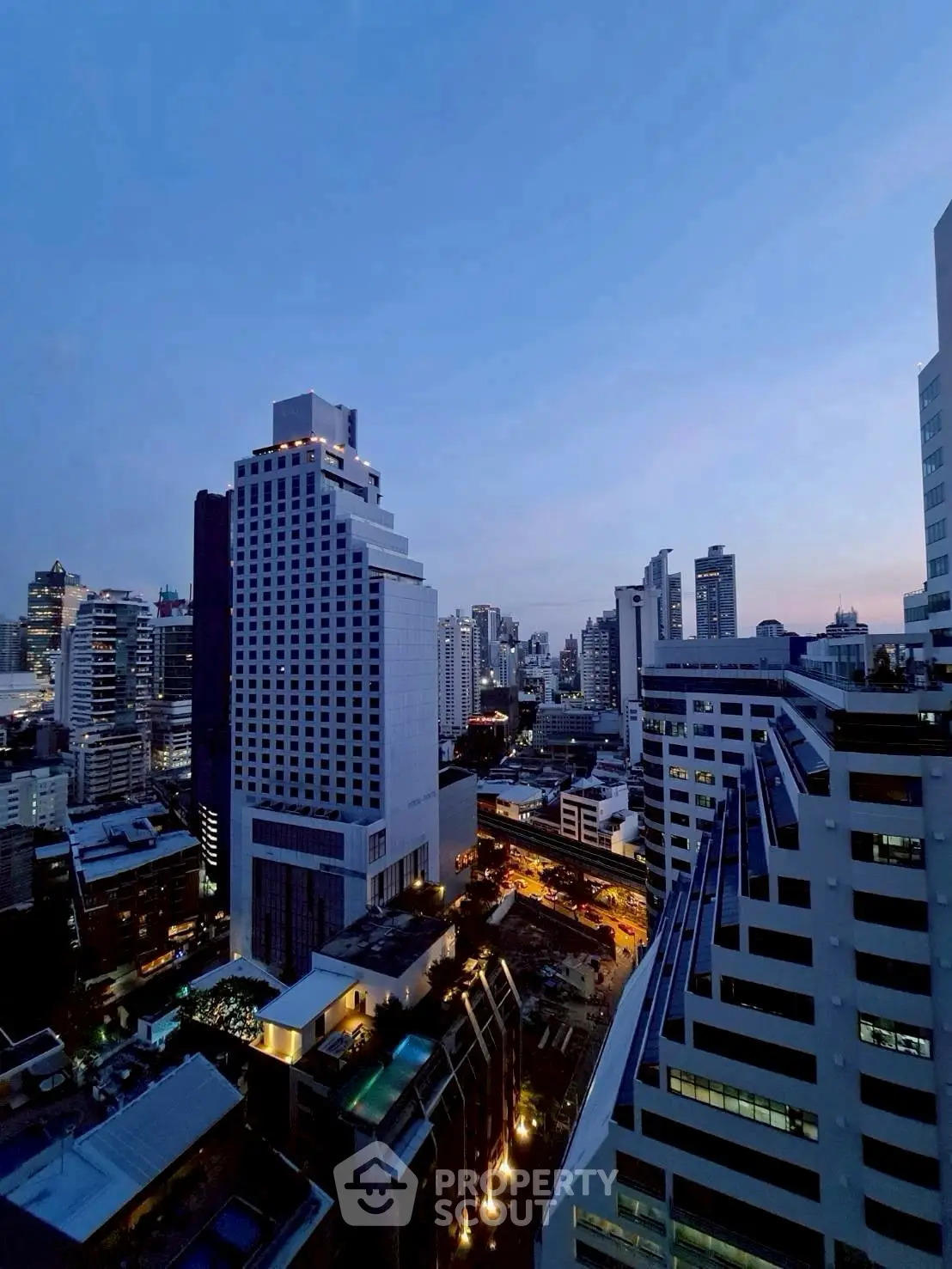 Stunning cityscape view showcasing modern high-rise buildings at dusk.