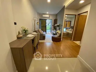 Modern open-plan living room with stylish decor and natural light