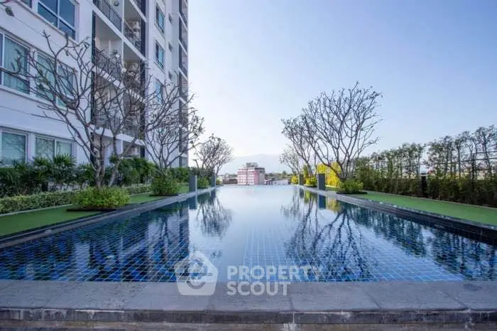 Luxurious rooftop infinity pool with stunning city views in modern apartment complex
