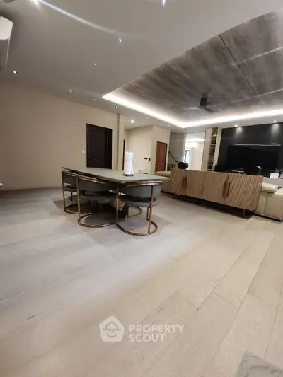 Spacious modern living room with elegant dining area and stylish decor