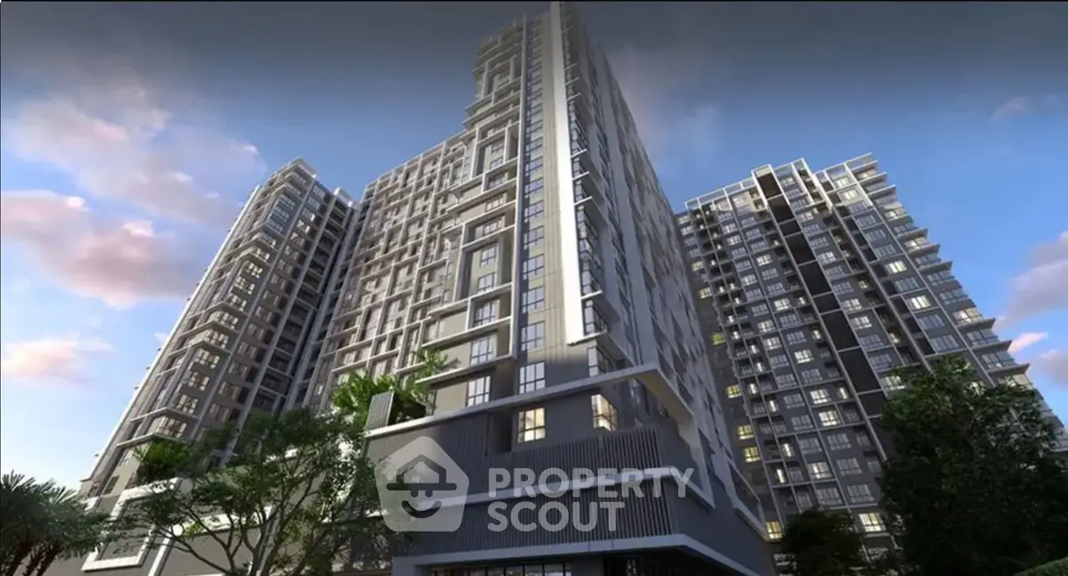 Modern high-rise residential building with sleek architecture and lush greenery.