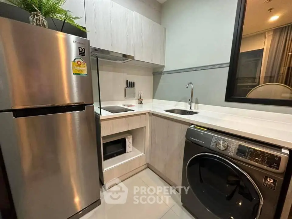 Modern kitchen with stainless steel appliances and sleek cabinetry