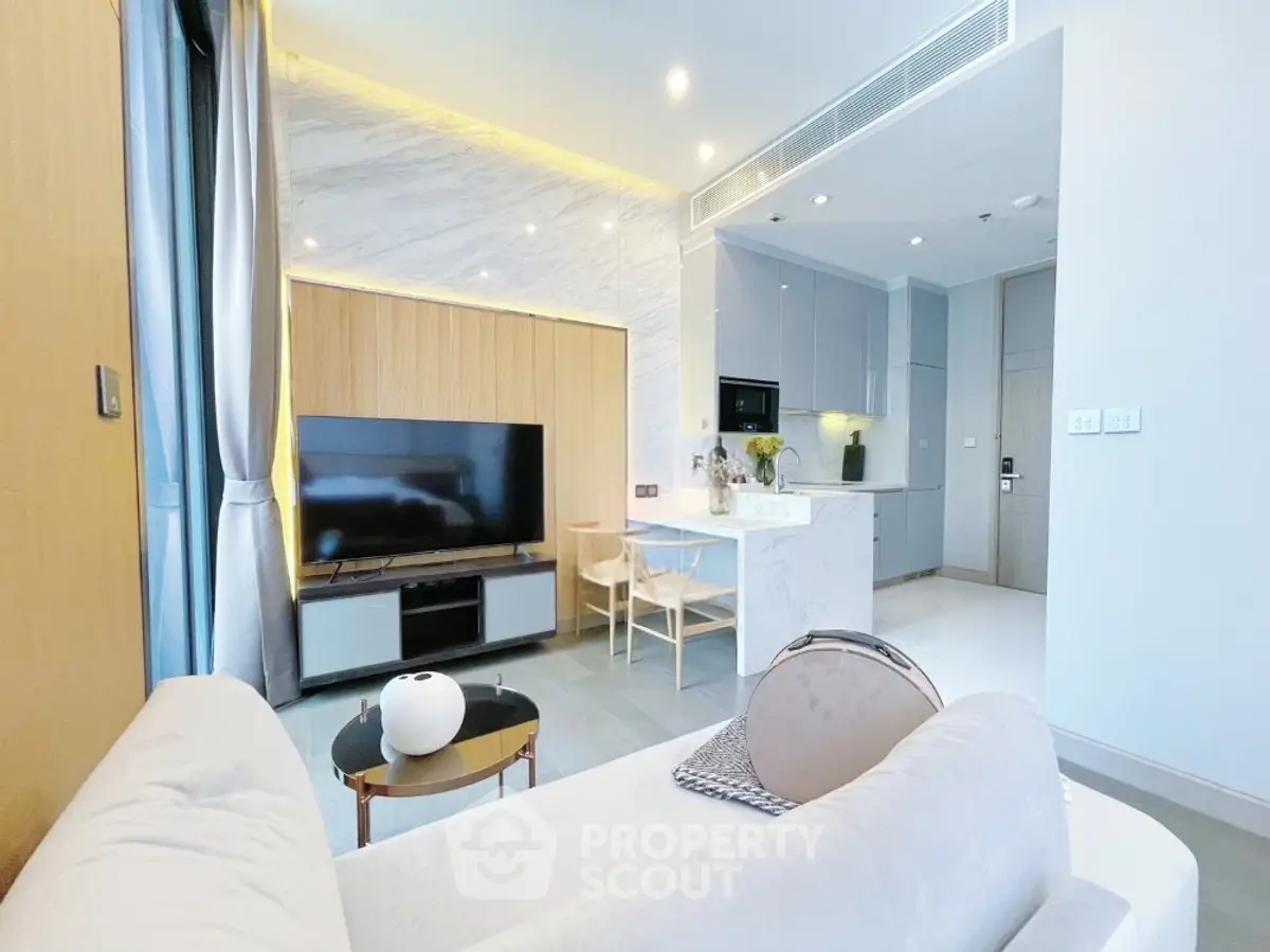 Modern living room with open kitchen and stylish decor