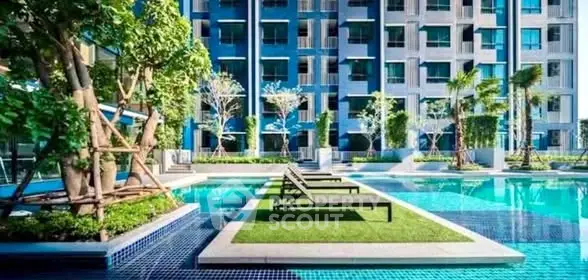 Luxurious apartment complex with stunning pool and modern architecture