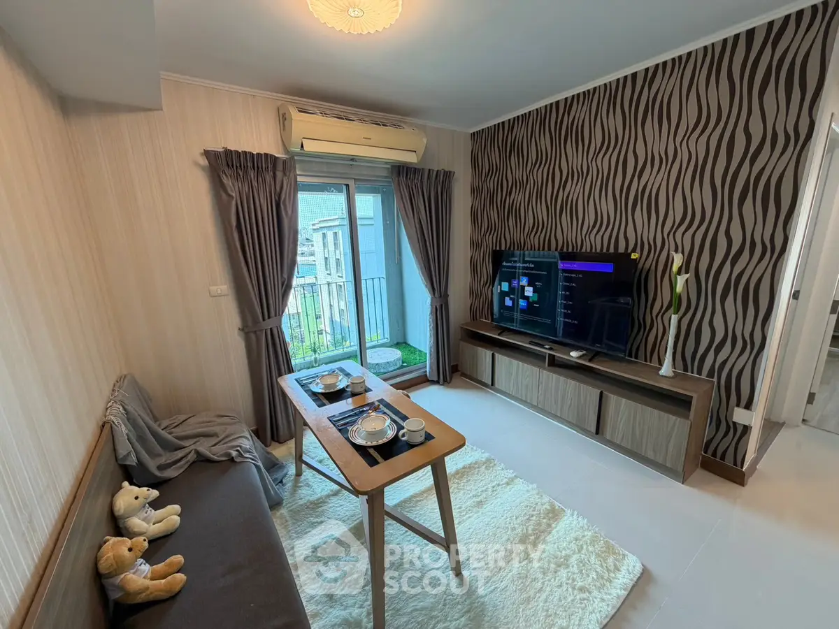 Modern living room with stylish decor and balcony view