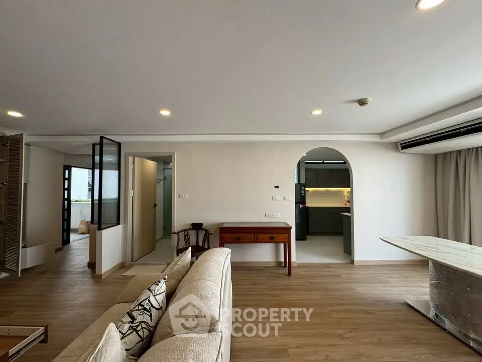 Spacious living room with modern open layout and stylish kitchen