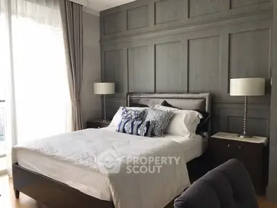 Luxurious bedroom with elegant panel wall and stylish decor