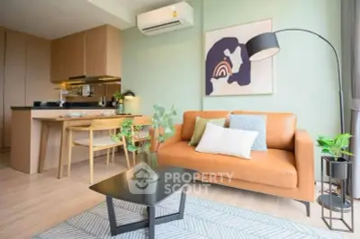 Modern living room with stylish decor and open kitchen layout