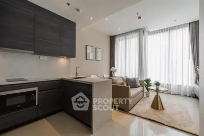 Modern open-plan living room with sleek kitchen and stylish decor