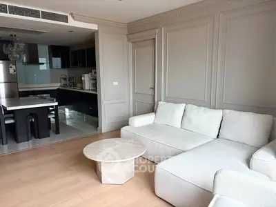 Spacious modern living room with open kitchen and elegant decor