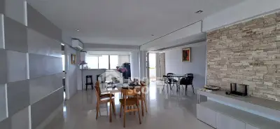 Spacious open-plan living and dining area with modern decor and natural light.