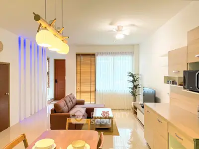 Modern living room with stylish furniture and natural light, featuring a cozy brown sofa and sleek wooden accents.