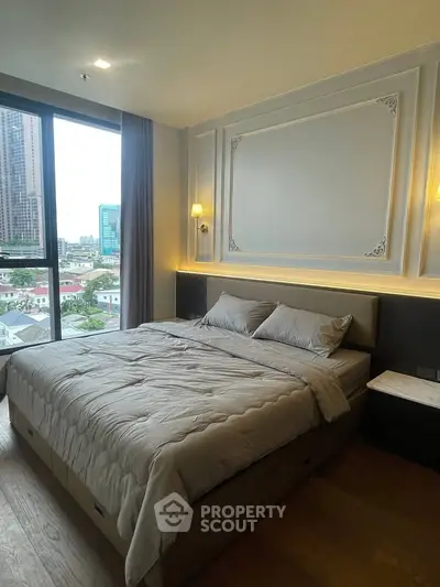Luxurious bedroom with city view in modern high-rise apartment