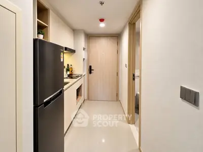 Modern compact kitchen with sleek appliances and minimalist design