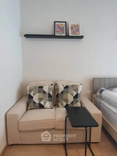 Cozy living room corner with modern sofa and stylish decor in a contemporary apartment.