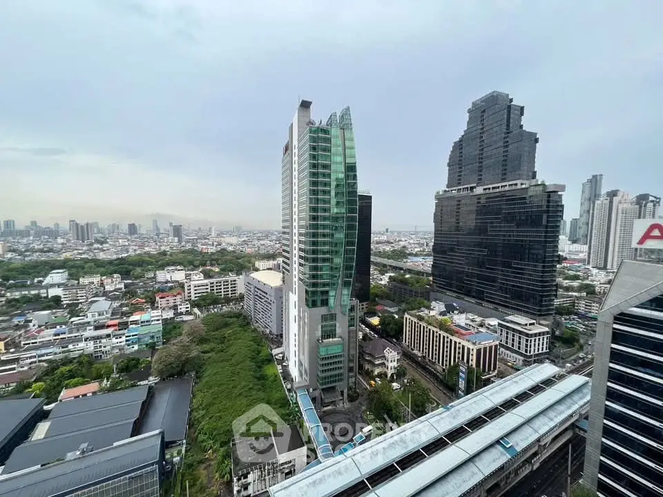 Stunning cityscape view showcasing modern skyscrapers and lush greenery, perfect for urban living enthusiasts.