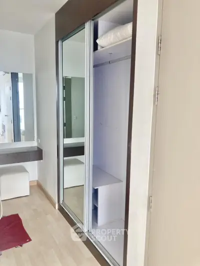 Modern bedroom with built-in wardrobe and sleek design