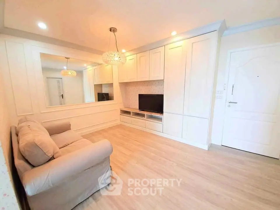 Elegant living room with modern decor, cozy sofa, and built-in entertainment center.