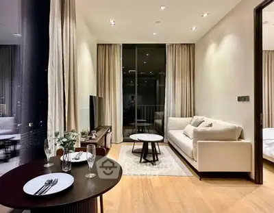 Modern living room with elegant decor and large windows in a luxury apartment.