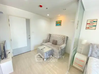 Cozy living room with elegant furniture and modern decor in a bright apartment.
