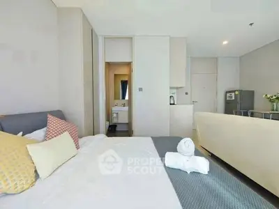 Modern bedroom with ensuite bathroom and stylish decor in a contemporary apartment.