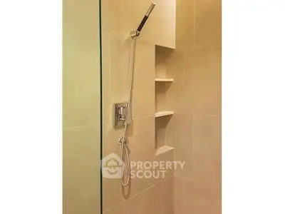 Modern bathroom shower with sleek design and built-in shelving