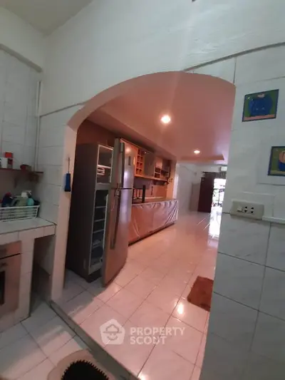 Spacious kitchen with modern appliances and open layout, perfect for culinary enthusiasts.
