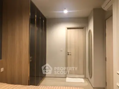 Cozy bedroom with modern wardrobe and soft lighting