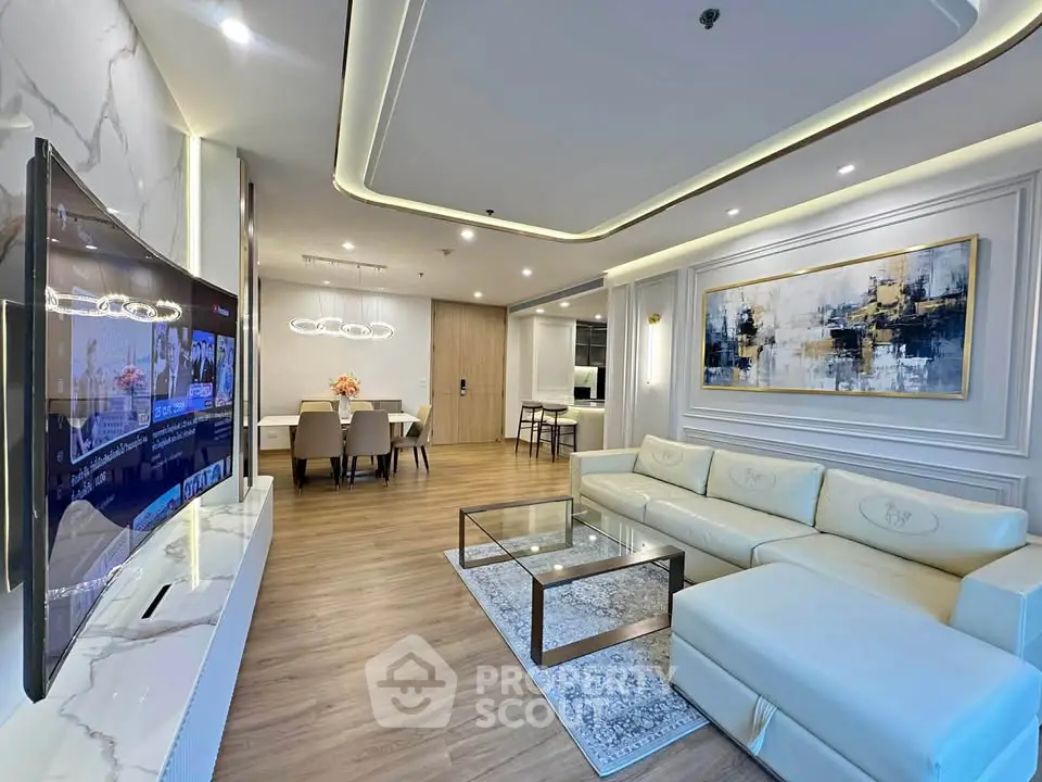 Luxurious modern living room with elegant decor and spacious dining area, perfect for stylish urban living.