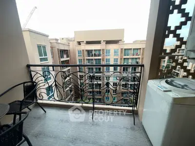 Charming balcony with city view, perfect for relaxation and enjoying the urban skyline.