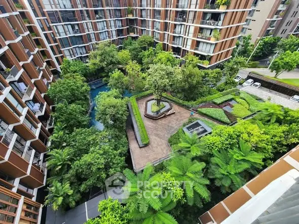 Stunning aerial view of lush garden courtyard in modern residential complex.