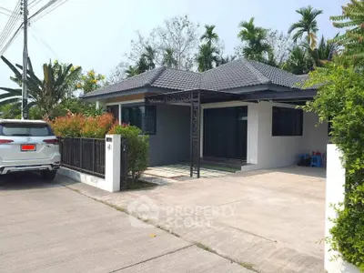 Charming single-story house with modern design and spacious driveway