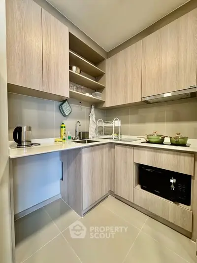 Modern kitchen with sleek cabinetry and built-in appliances