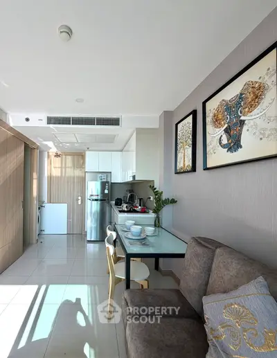 Modern living room with stylish decor and open kitchen layout