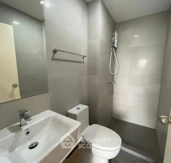 Modern bathroom with sleek fixtures and walk-in shower