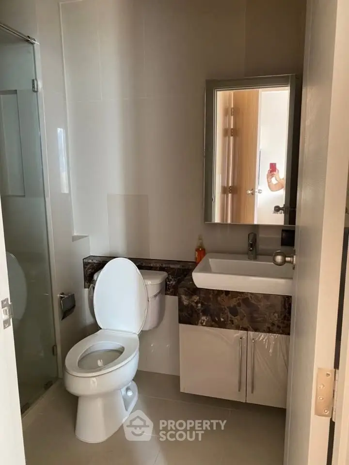 Modern bathroom with sleek fixtures and elegant marble countertop