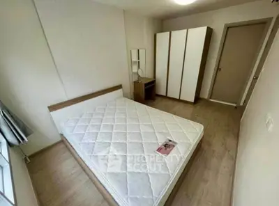 Spacious bedroom with modern wardrobe and natural light