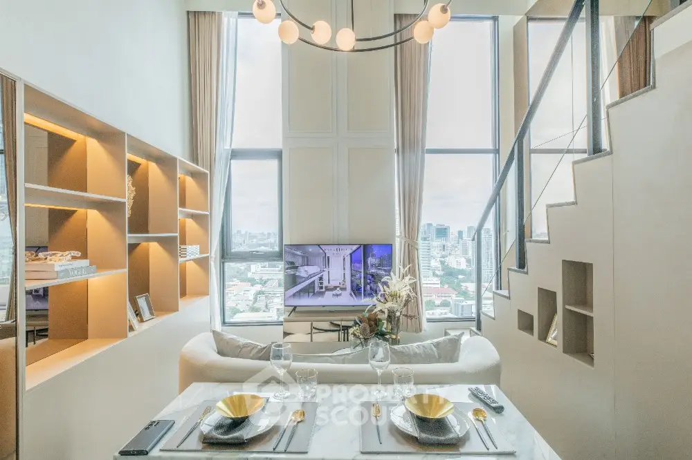 Luxurious modern living room with high ceilings and city view, featuring elegant decor and stylish staircase.