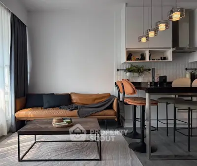 Modern living room with stylish leather sofa and chic bar stools in open layout.