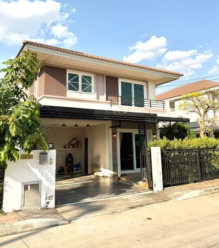 Charming two-story house with modern design and spacious driveway in a serene neighborhood.