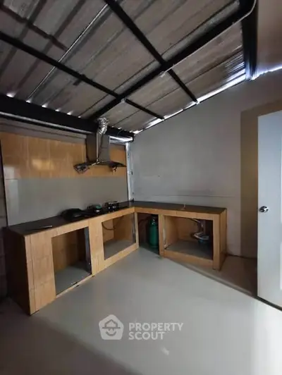 Spacious kitchen with open layout and modern cabinetry in a contemporary home.