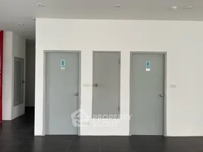 Modern building interior with restroom doors and minimalist design
