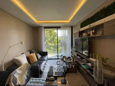 Modern living room with stylish decor and natural light from large window.