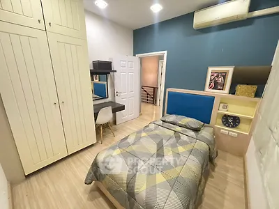 Cozy bedroom with modern decor and built-in wardrobe