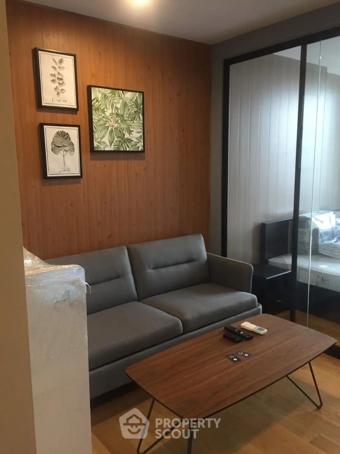 Modern living room with stylish decor and cozy seating area in a contemporary apartment.