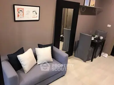 Cozy living room with modern decor and dining area, perfect for urban living.