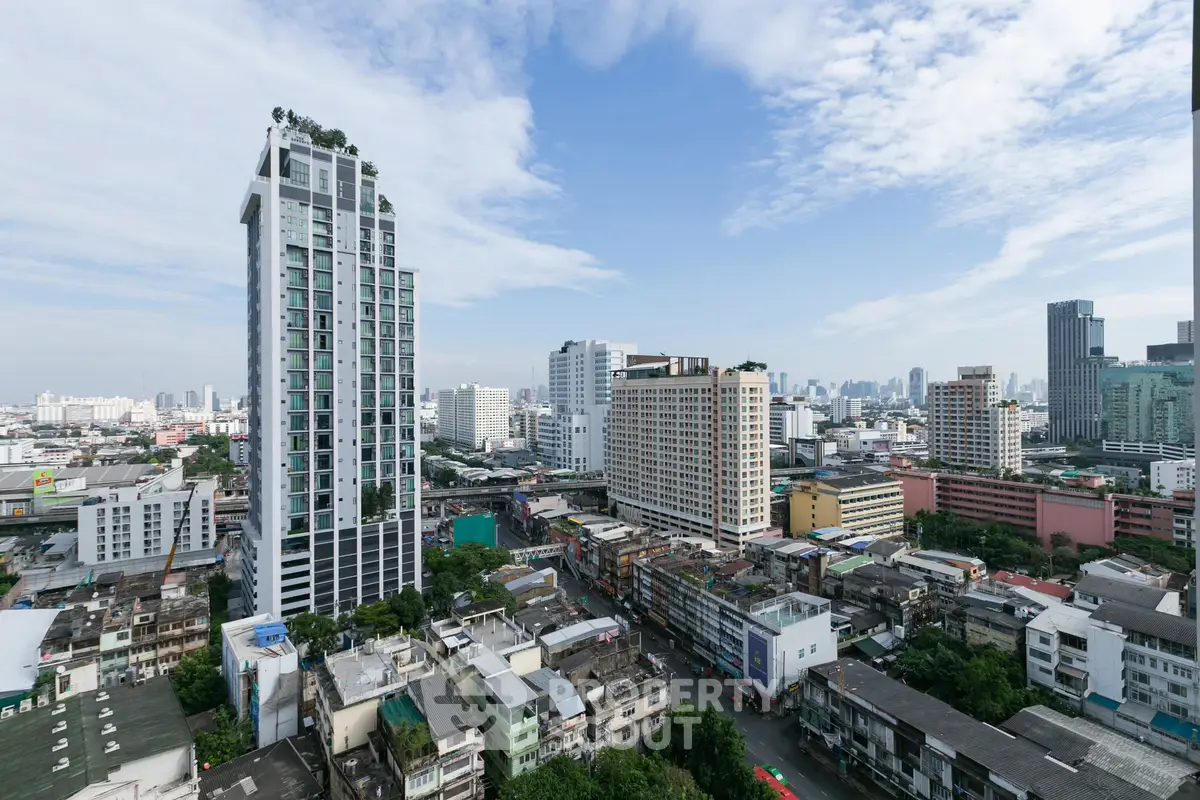 Stunning cityscape view showcasing modern high-rise buildings under a clear blue sky.