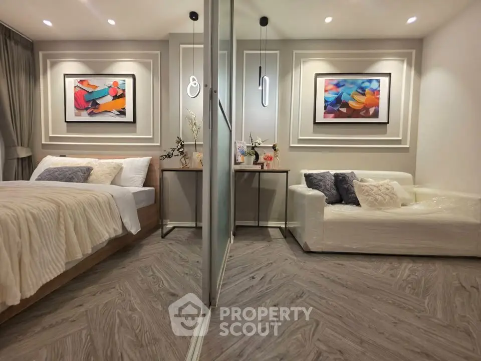 Stylish modern bedroom with elegant decor and cozy seating area, perfect for relaxation and comfort.